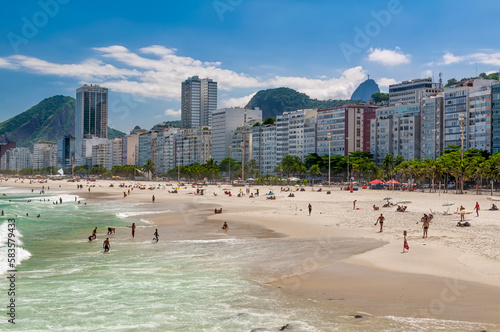 Fototapeta Naklejka Na Ścianę i Meble -  Copacabana beach in Rio de Janeiro, Brazil. Copacabana beach is the most famous beach in Rio de Janeiro. Sunny cityscape of Rio de Janeiro