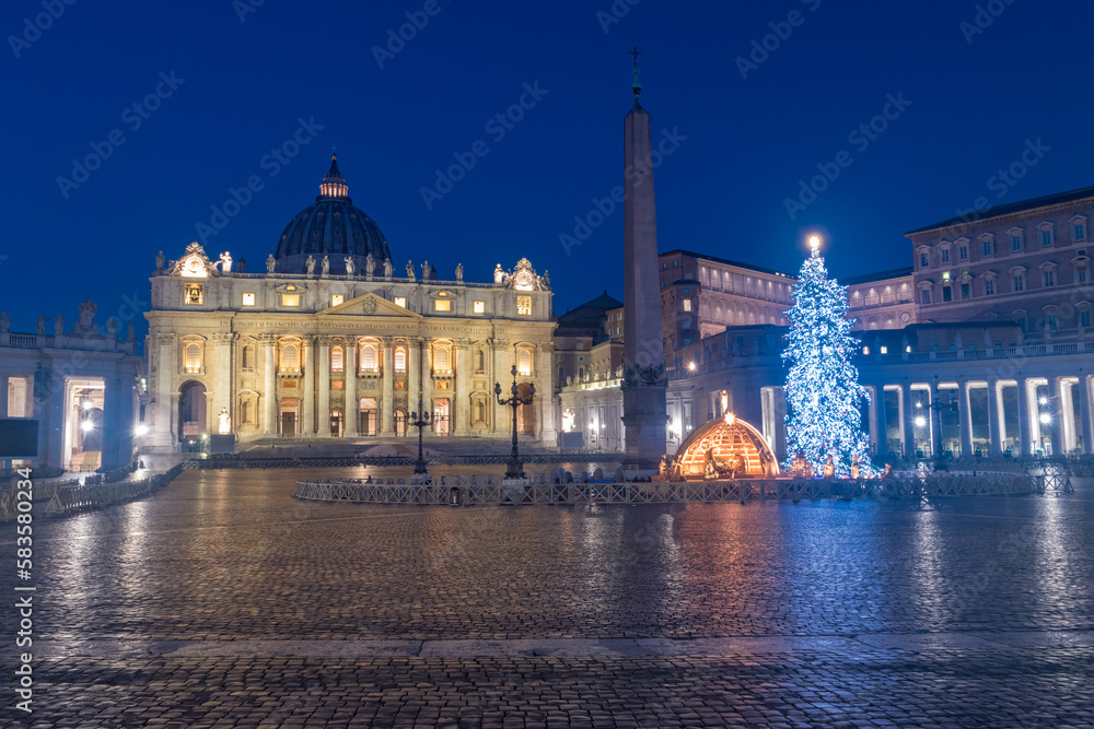 Naklejka premium St. Peter Basilica with Nativity scene and Christmas tree at Christmas time in Vatican at night.