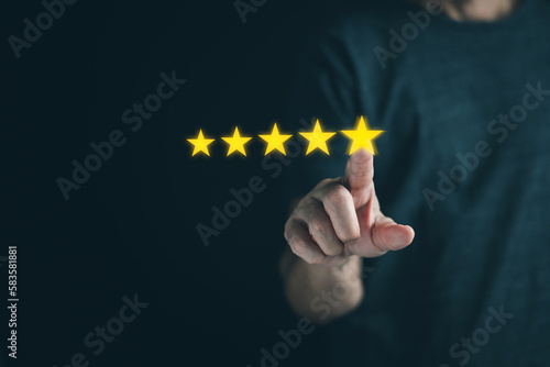 Close up businessman hand gives five star symbol to increase rating of product and service concept, Customer service and business satisfaction survey,selective focus.