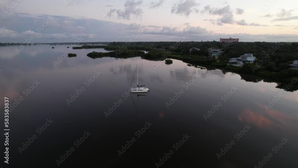 Aerial view of two boats on lake during sunset Aerial view of two boats on lake during sunset