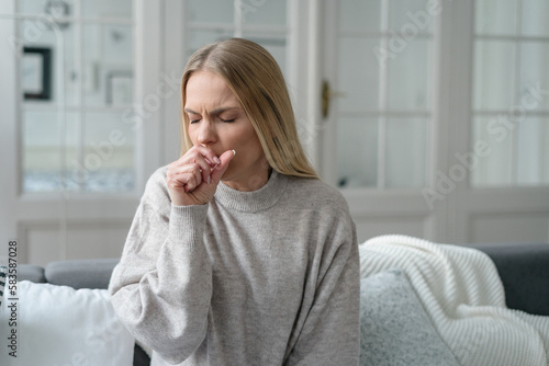 Fototapeta sick female coughing and has viral infection