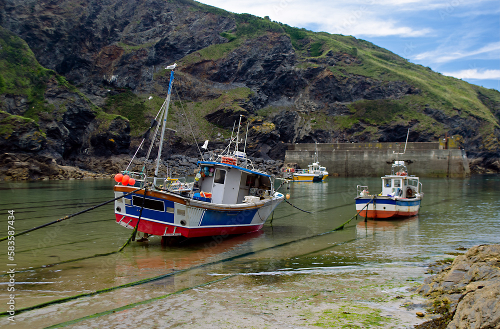 Port Isaac Harbour with moored fishing boats in Cornwall