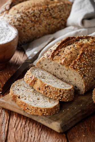 Wallpaper Mural Rustic whole grain bread on a cutting board on a wooden kitchen table Torontodigital.ca