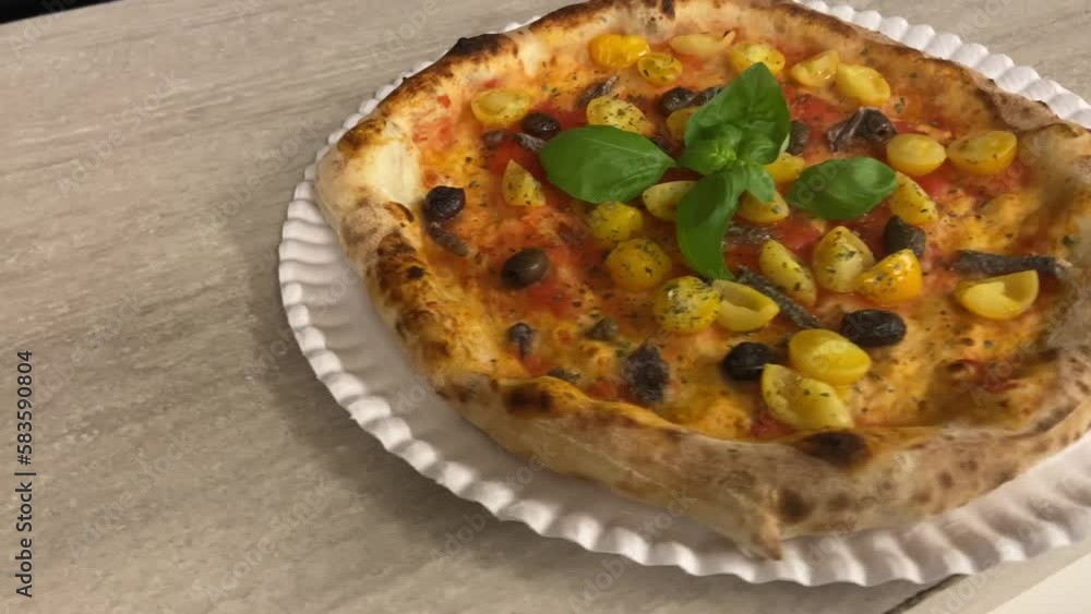 Super marinara pizza. Topping of yellow cherry tomatoes, Taggiasca olives, Cetara anchovies, capers and San Marzano tomato sauce. Very pronounced crust in a contemporary Neapolitan style. Super marinara pizza. Topping of yellow cherry tomatoes, Taggiasca olives, Cetara anchovies, capers and San Marzano tomato sauce. Very pronounced crust in a contemporary Neapolitan style.