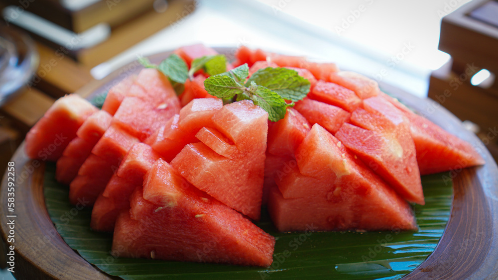 Zoom of Slice of Watermelon Fruits on the Bananas Leave