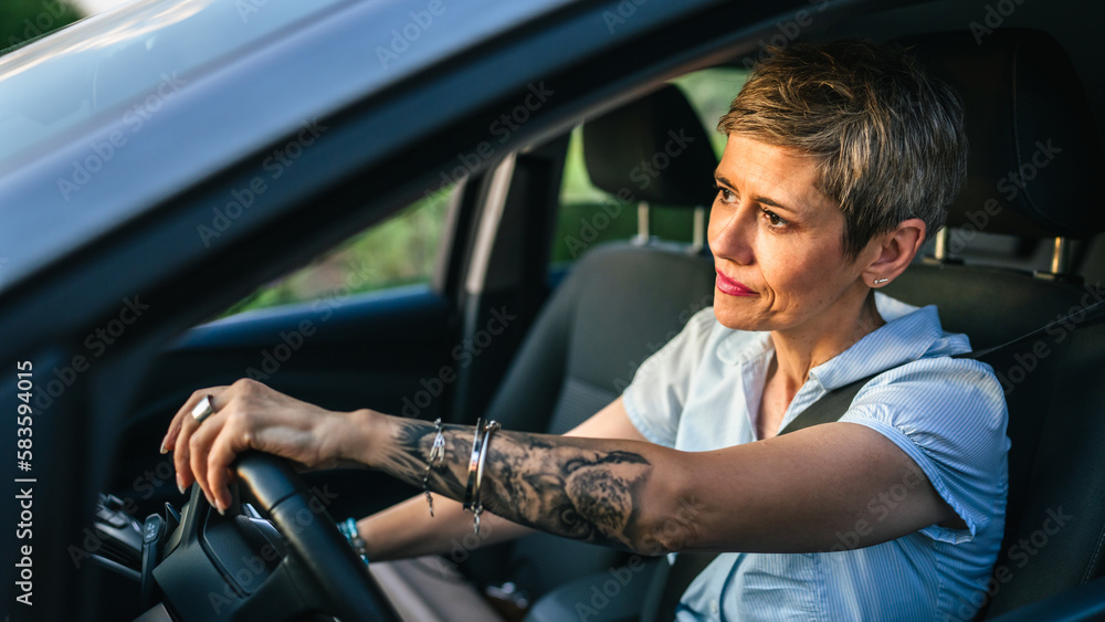 Stressed angry mature senior woman in driver's seat car frustration Stressed angry mature senior woman in driver's seat car frustration