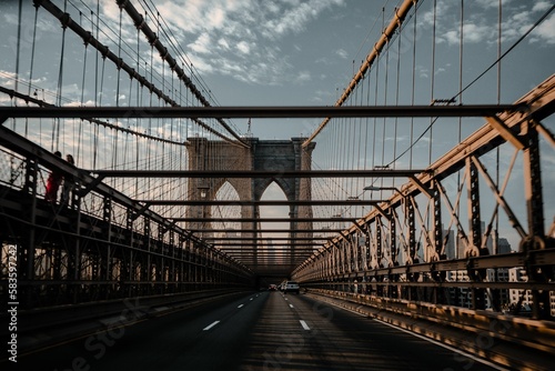 Beautiful shot of the Brooklyn Bridge with the road in New York City,USA