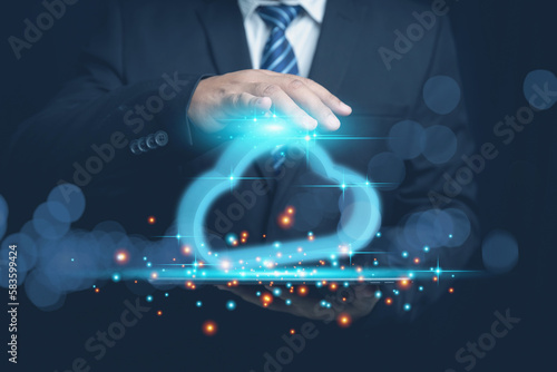 Businessman holding cloud computing icon network on hand black background. Technology upload, download use cloud system of transfer database online confidential data of business on internet.
