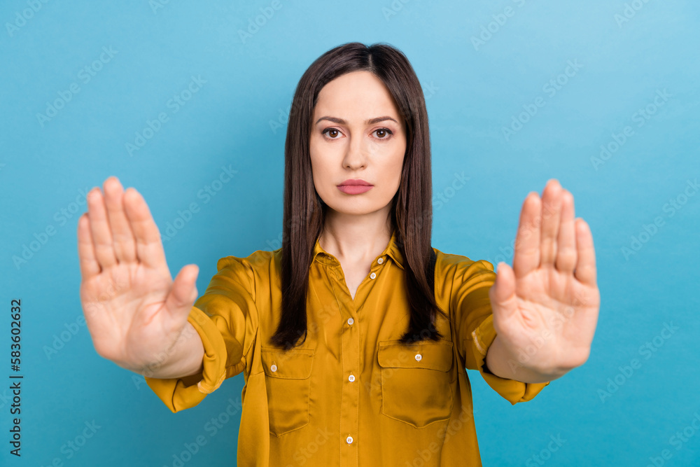 Closeup photo of serious confident unhappy woman business owner hands veto vs press conference reportage isolated on blue color background Closeup photo of serious confident unhappy woman business owner hands veto vs press conference reportage isolated on blue color background