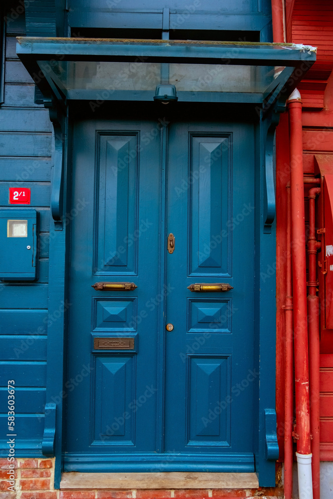 Large heavy wooden door  painted in blue in Kuzguncuk, Istabnbul.