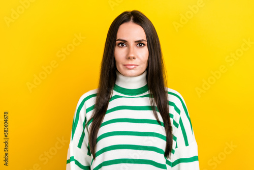 Photo of adorable confident woman wear striped sweater smiling isolated yellow color background © deagreez