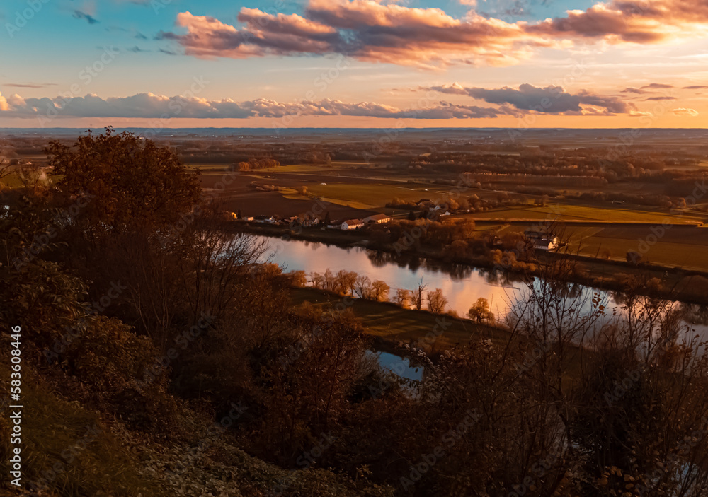 Autumn or indian summer sunset with reflections at Mount Bogenberg, Bogen, Danube, Bavaria, Germany