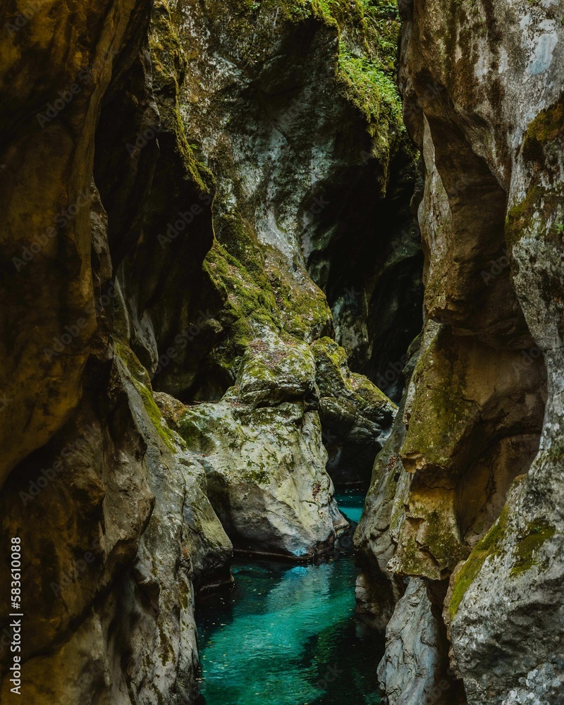 Scenic view of a small river with turquoise water in Tolmin Gorges park in Zatolmin, Slovenia Scenic view of a small river with turquoise water in Tolmin Gorges park in Zatolmin, Slovenia