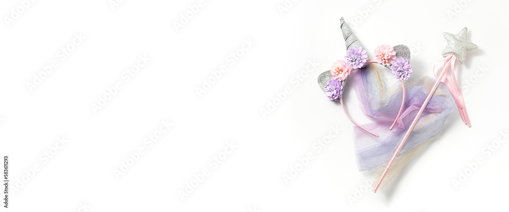 Fairy costume, unicorn on a white background. Top view, flay lay. Banner