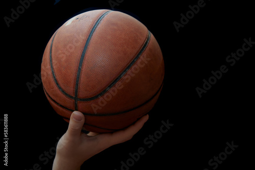 Game basketball on the wrist of one hand close-up © Александр Ланевский