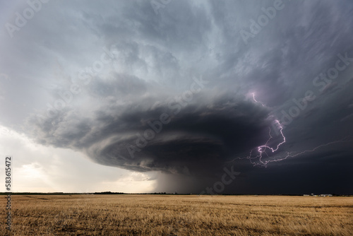 Storm clouds and lightning from a supercell thunderstorm photo