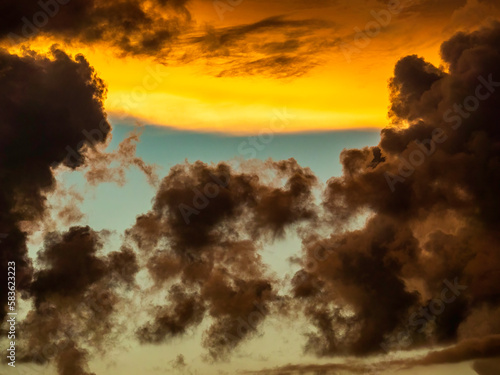 Dramatic cloudscape at sunset in summer, with dark clouds that indicate the approach of night and perhaps a storm, in southwest Florida, for motifs of transition and change