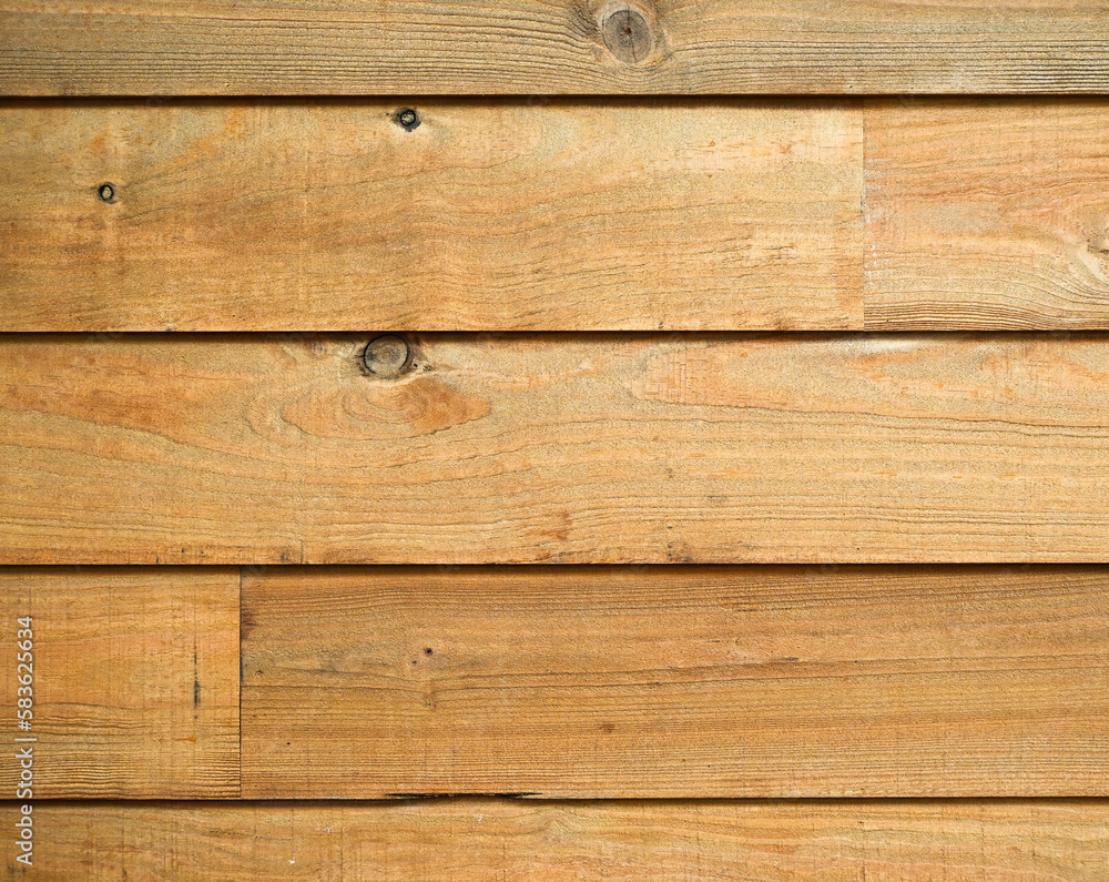 Fondo con detalle y textura de lamas de madera con nudos y vetas, con tonos marron antiguo Fondo con detalle y textura de lamas de madera con nudos y vetas, con tonos marron antiguo
