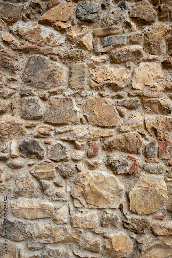 Fototapeta premium Texture of stone wall. Old castel wall, texture background. Tuscany, Italy