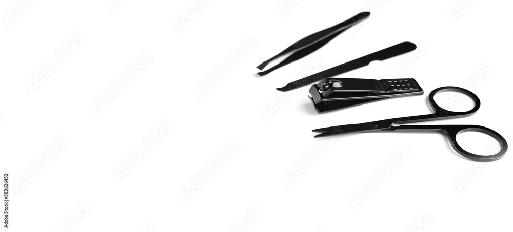 Banner of set of steel manicure and pedicure tools isolated on white with copy space. Classic metal kit of nail scissors, tweezer and manicure tools. Domestic nail beauty care objects. Banner of set of steel manicure and pedicure tools isolated on white with copy space. Classic metal kit of nail scissors, tweezer and manicure tools. Domestic nail beauty care objects.