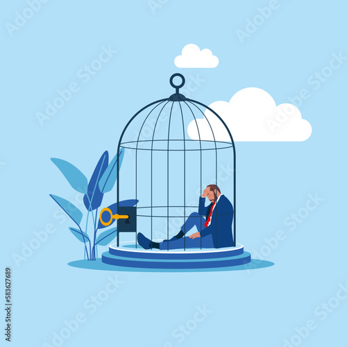 Photo Depressed businessman lock herself sit inside birdcage