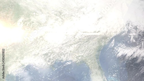 Earth zoom in from outer space to city. Zooming on Talladega, Alabama, USA. The animation continues by zoom out through clouds and atmosphere into space. Images from NASA photo