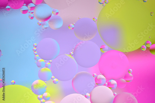 Abstract bright background, oil circles on the water surface.