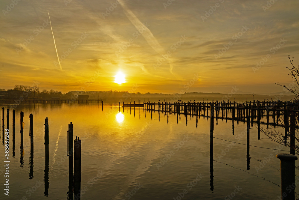 Obraz premium view over Chiemsee lake in sunset