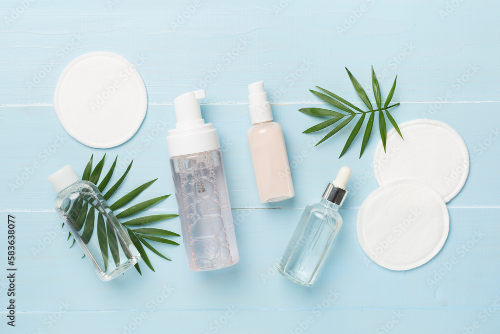 Face care products with eco pads on wooden background, top view Face care products with eco pads on wooden background, top view