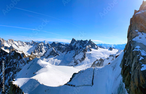 View of the glacier valley of the Mont Blanc massif seen from the Aiguille du Midi. French Alps, Europe.