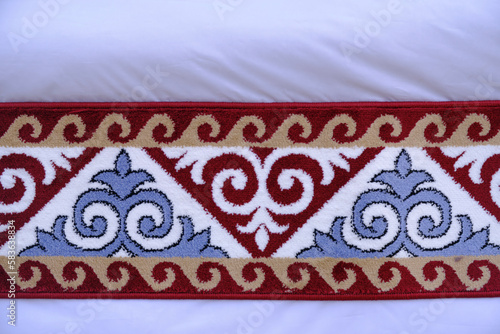 Kazakh national patterns are embroidered carpet.