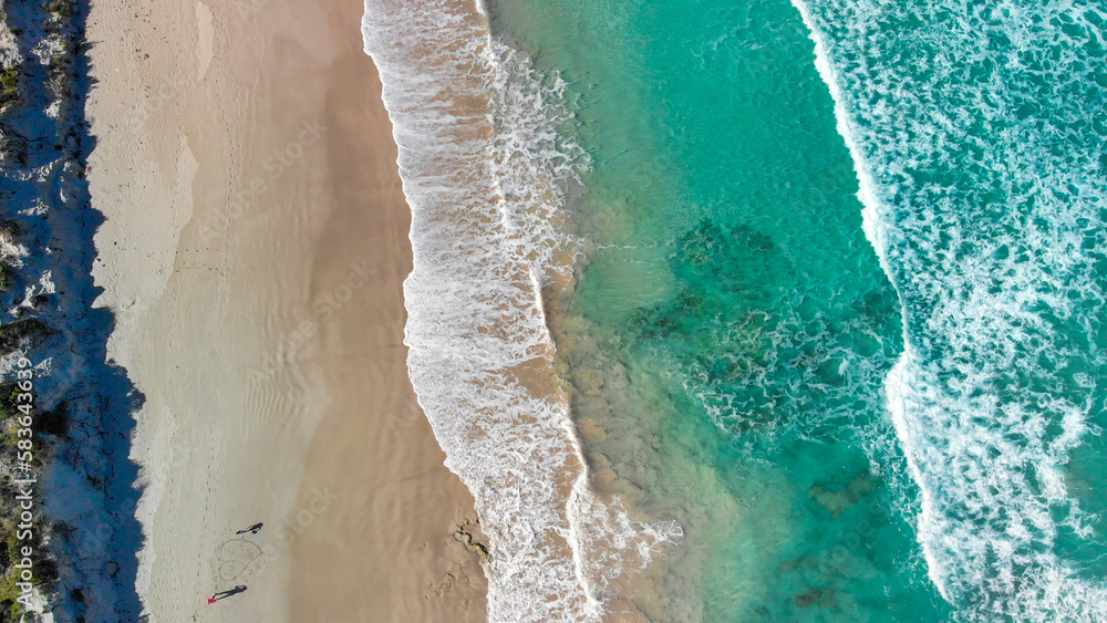 Above the ocean, aerial view at the waves and surface near shoreline - Drone viewpoint Above the ocean, aerial view at the waves and surface near shoreline - Drone viewpoint