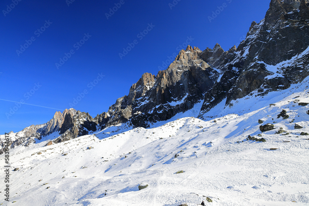 View of the Mont Blanc massif seen from the Aiguille Plan. French Alps, Europe.