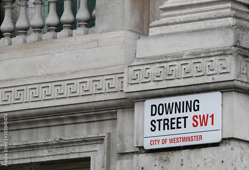 Downing Street sign on the wall of a building in Westminster, London, England, UK. 