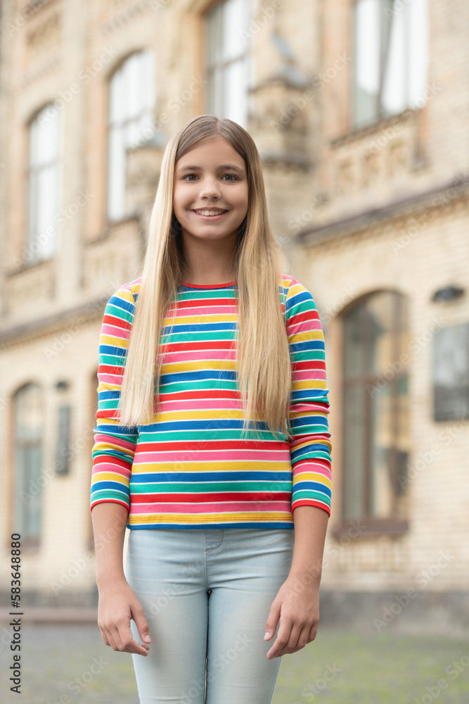 Fototapeta premium happy blond teenager girl outside. young teenager girl outdoor. photo of teenager girl.