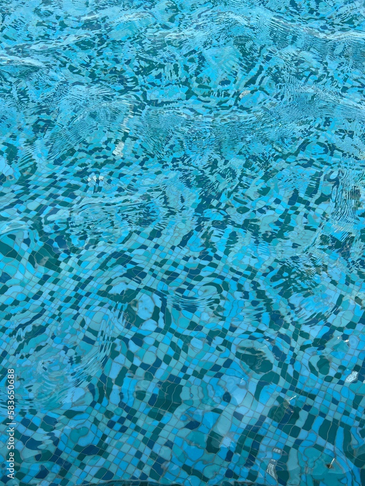 view of blue colored water in a street fountain