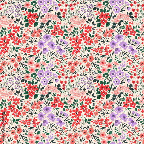 Vintage floral background. Floral pattern with small colorful flowers on a ivory background. Seamless pattern for design and fashion prints. Ditsy style. Stock vector illustration.