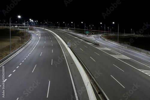 highway crossroad at night with modern street lights