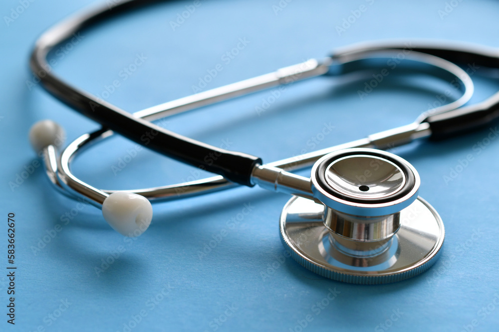 A stethoscope on a light blue background. minimal, simple, medical, healthcare A stethoscope on a light blue background. minimal, simple, medical, healthcare
