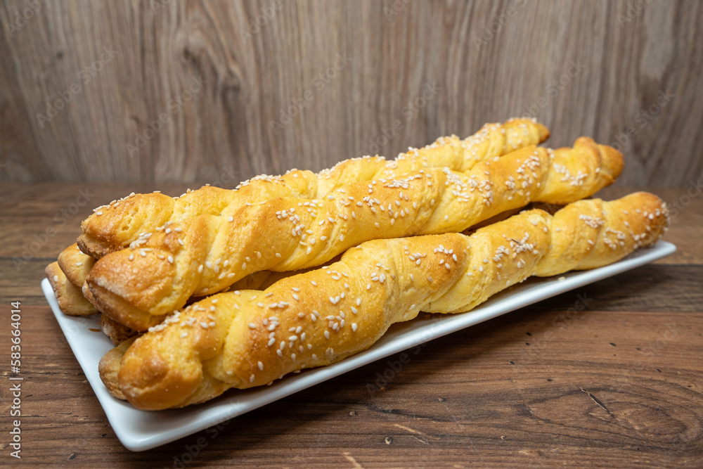 Puff pastry sticks. Close-up of puff pastry with sesame seeds.