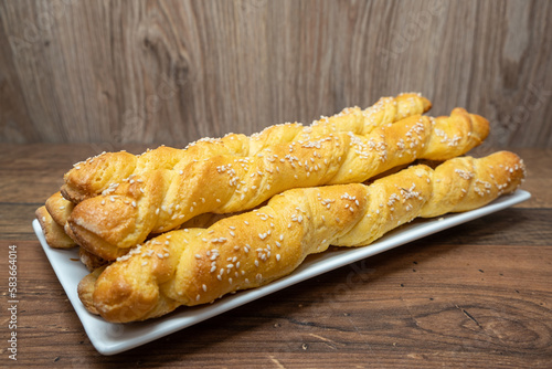 Obraz na płótnie Puff pastry sticks. Close-up of puff pastry with sesame seeds. w salonie