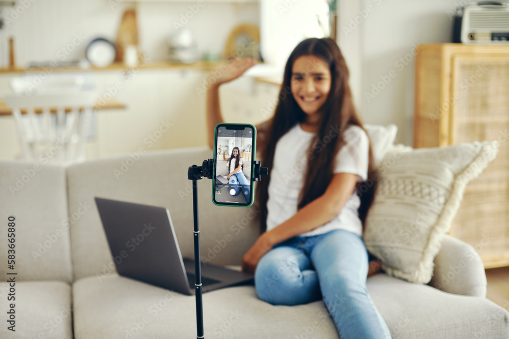 Cute preteen girl blogger greeting virtual friends start stream Stock ...