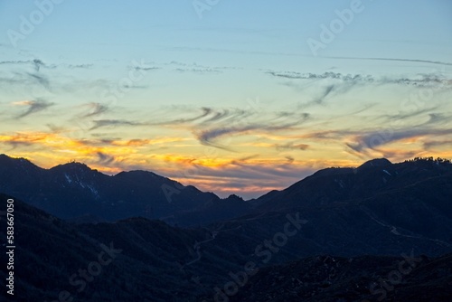 The sun sets and dusk falls on the Angeles Crest Highway, a winding route through the San Gabriel Mountains and Angeles National Forest just north of Los Angeles © Andrew