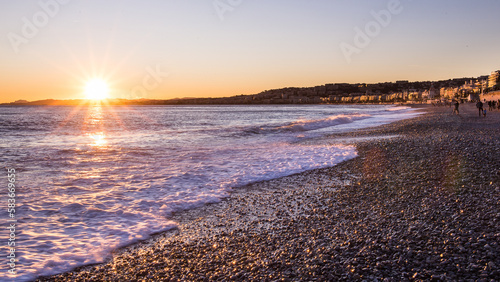 Sunset at the city beach of Nice at the French Riviera