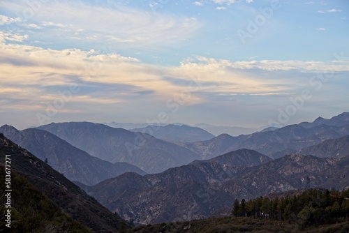 The winding Angeles Crest Highway provides views over the Los Angeles Basin and surrounding urban valleys  the snow-dusted San Gabriel and San Bernandino Mountains and the Mojave Desert
