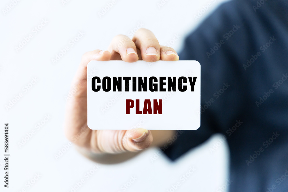 Contingency plan text on blank business card being held by a woman's hand with blurred background. Business concept about contingency plan. Contingency plan text on blank business card being held by a woman's hand with blurred background. Business concept about contingency plan.