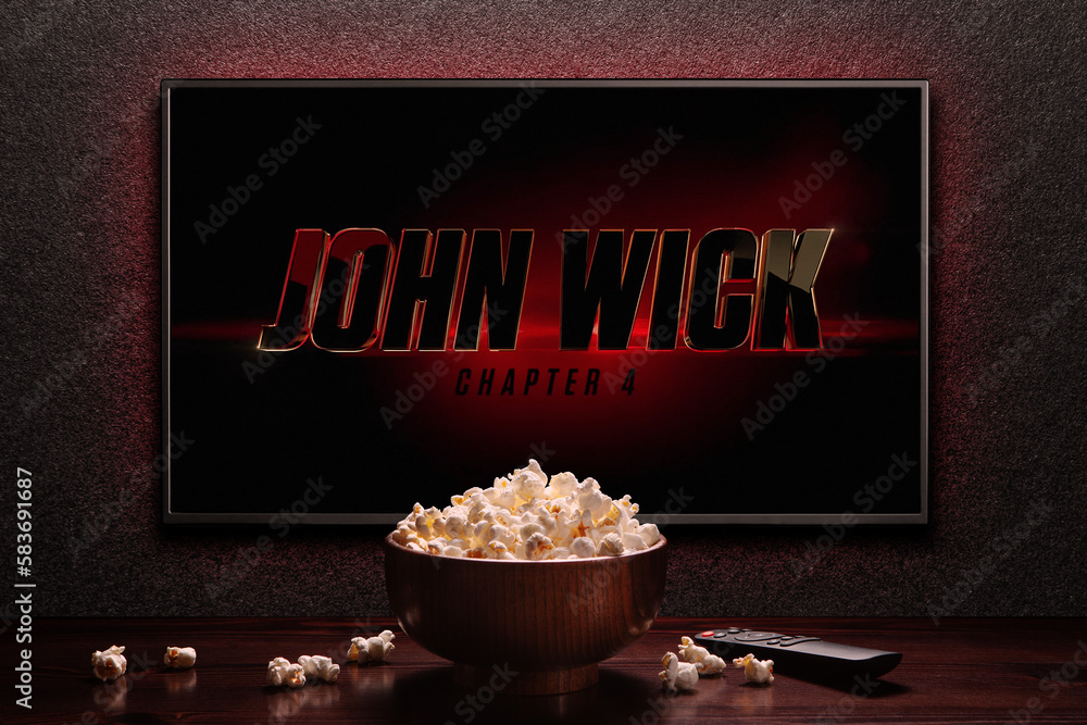 Foto de TV screen playing John Wick Chapter 4 trailer or movie. TV with