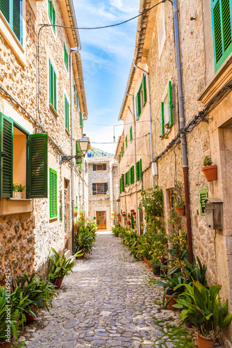 Stone paved narrow street, in Valdemossa medieval village, Mallorca, Balearic Islands, Spain © Stockphototrends