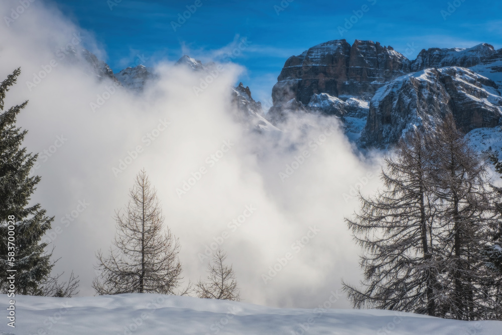 A beautiful view of Brenta Dolomites with fantastic clouds and Alps Madonna di Campiglio, Pinzolo, Italy. January 2023