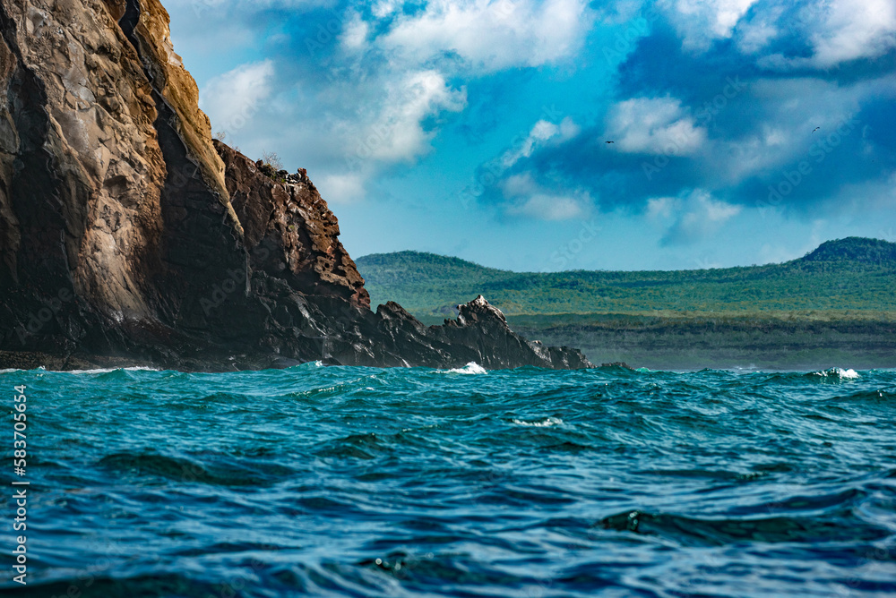 The wind-chopped waves along the coastline of the Galápagos Islands